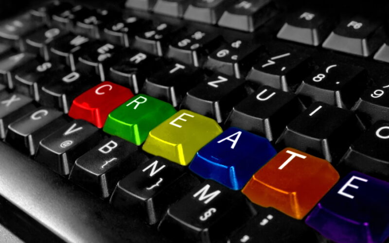 computer keyboard with the word 'create' in primary colors