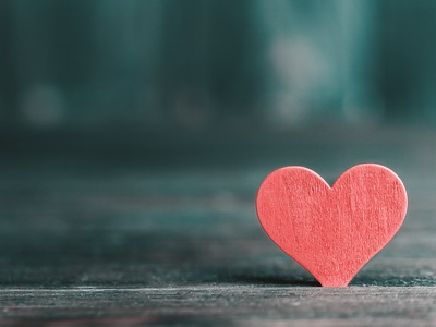 red heart on wooden background