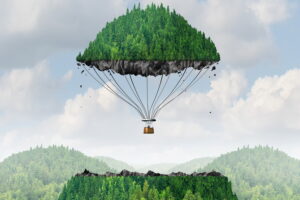 Imagination concept as a person lifting off with a detached top of a mountain floating up to the sky as a hot air balloon as a metaphor for the power of imagining traveling and dreaming of moving mountains.
