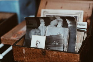 Old back and white photos in a small wooden box