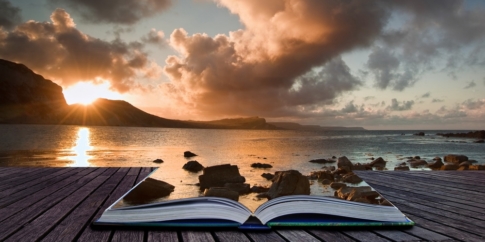 Creative composite image of seascape in pages of magic book